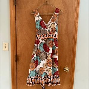 American Rag dress size L. Multi color, sleeveless, side zip with tie.